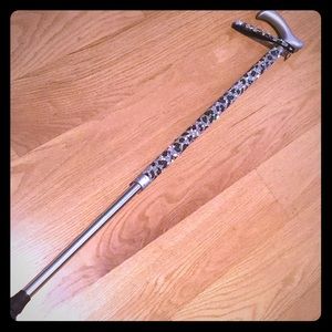 Silver/black leopard adjustable walking cane.